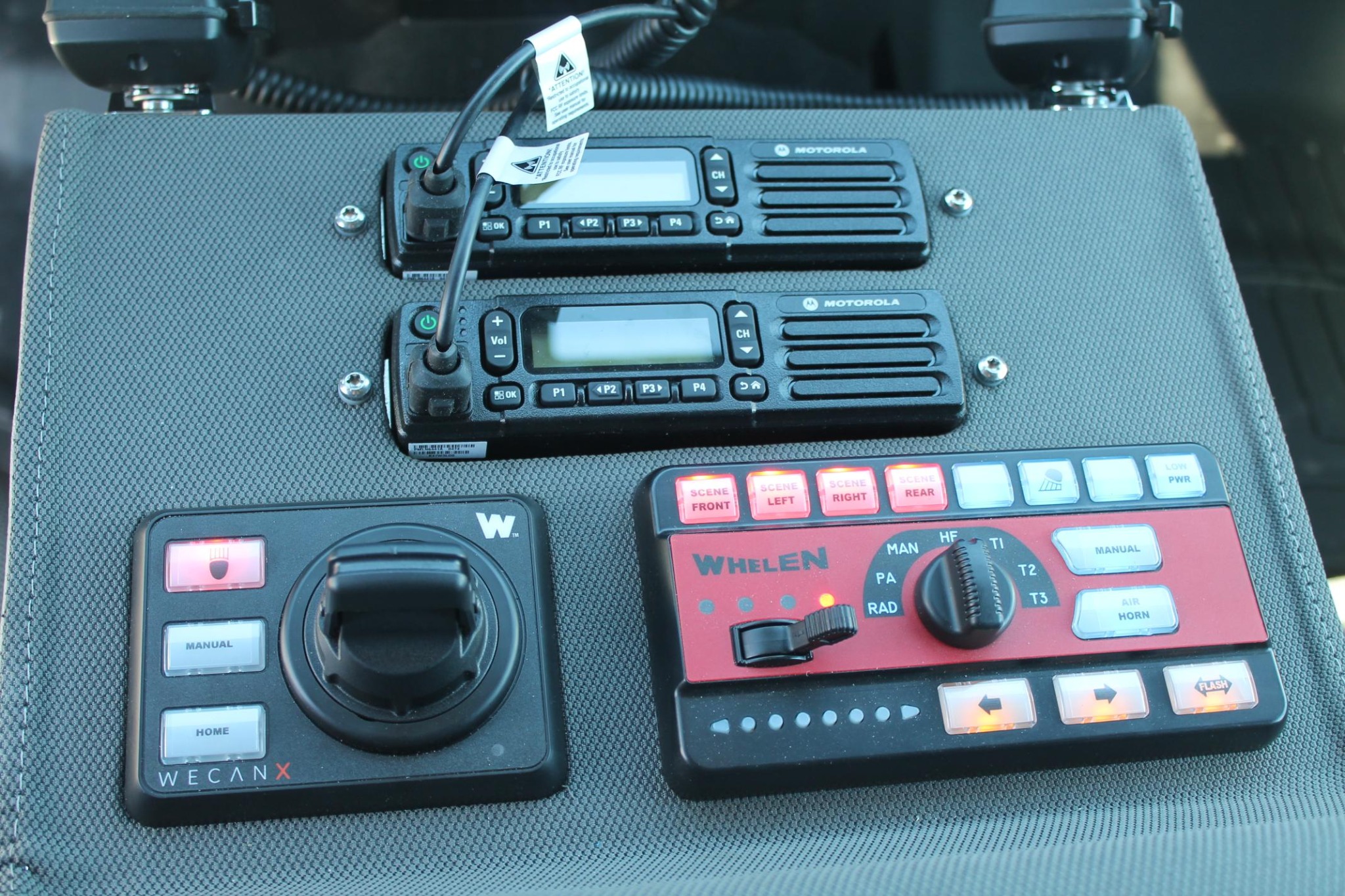 Motorola radios and Whelen emergency lighting controls integrated into a custom console